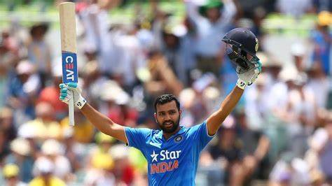Rohit Sharma celebrates after scoring a century against Australia.